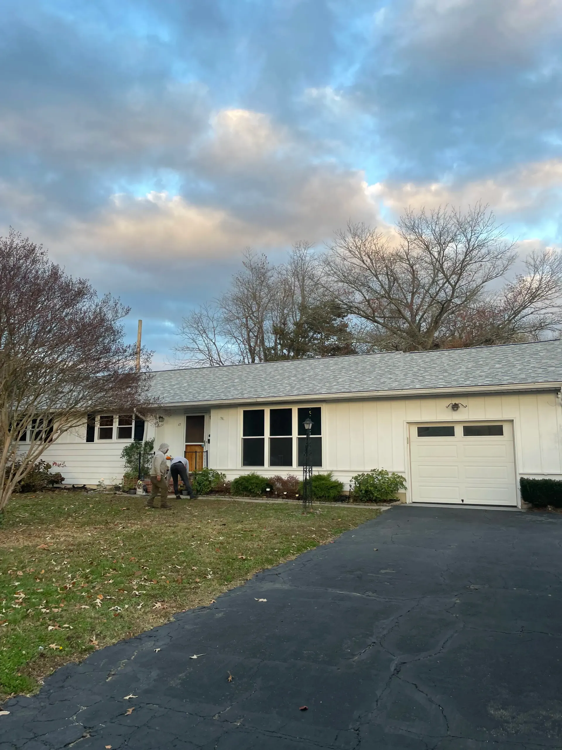 Ranch home with new shingle roof after