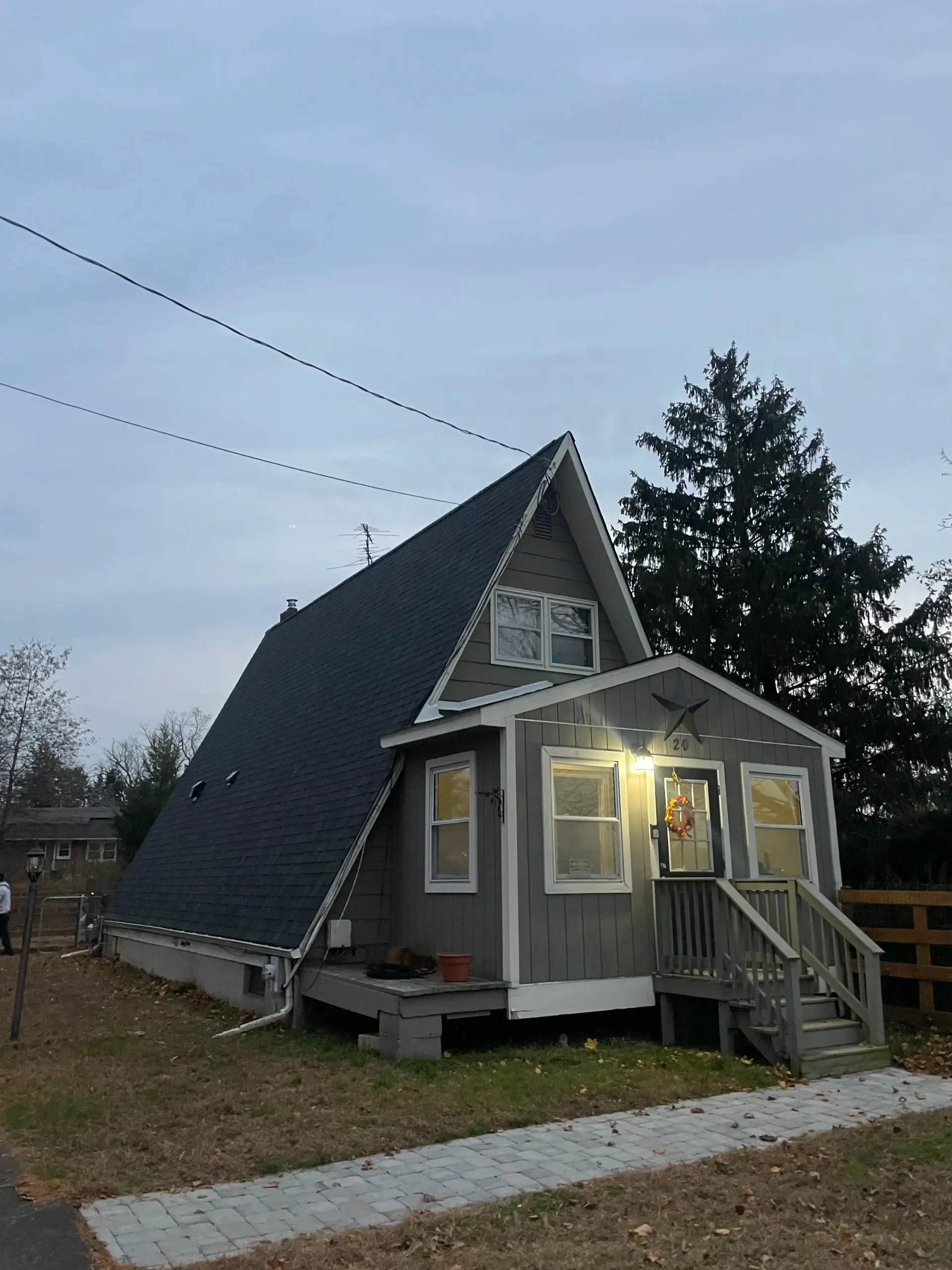 A-frame home after new roof at dusk